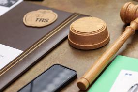 gavel and meeting notes on a desk