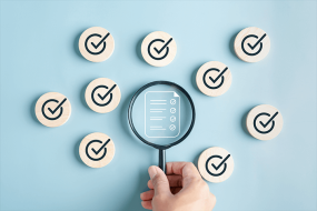 magnifying glass and checkmarks