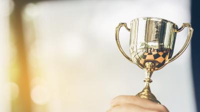 gold cup held high