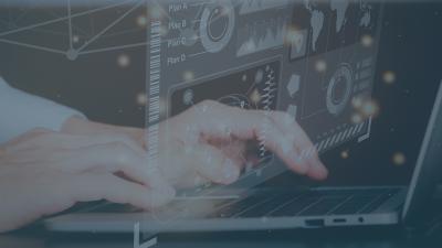 hands types on laptop that displays operations icons