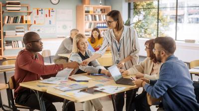 several teachers meeting in school classroom
