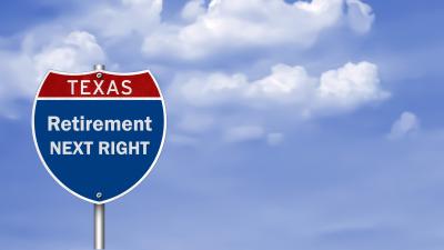 Blue sky with road sign that reads Retirement Next Right