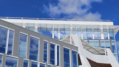 TRS building at Mueller Center with blue sky and clouds