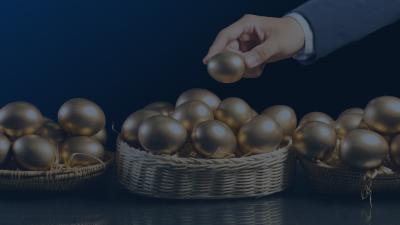 three baskets with gold eggs inside