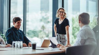 four coworkers meet in a bright office