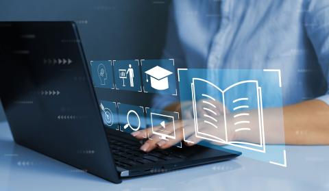 man types on laptop that shows training and learning icons