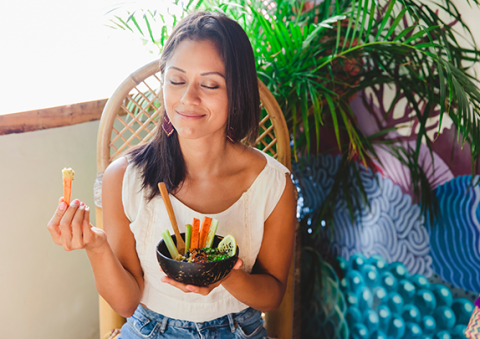 woman eating vegetables