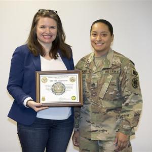 photo of female veteran receiving a certificate