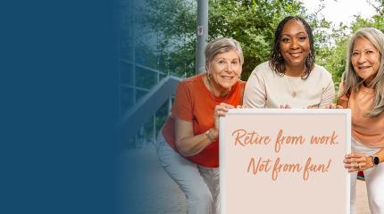 three senior women pose around a sign that says 'retire from work not from fun.'