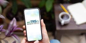 hand holding phone that display MyTRS logo
