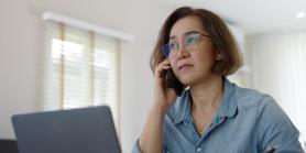 concerned woman talks on cell phone