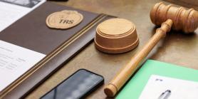 gavel and meeting notes on a desk