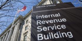 large sign in front of building that reads Internal Revenue Service Building