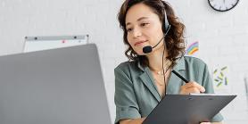 medical receptionist with headset talks to patient online