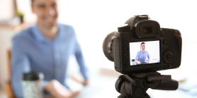 video camera records man talking into camera
