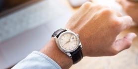 man's wrist with watch