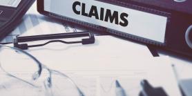 binder of claims with clipboard and pens