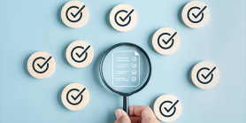 magnifying glass and checkmarks