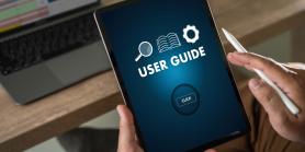 man holds tablet with user guide displayed on screen