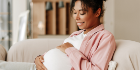 pregnant woman holding belly