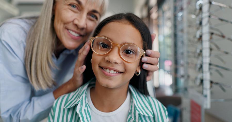 Child trying on glasses 