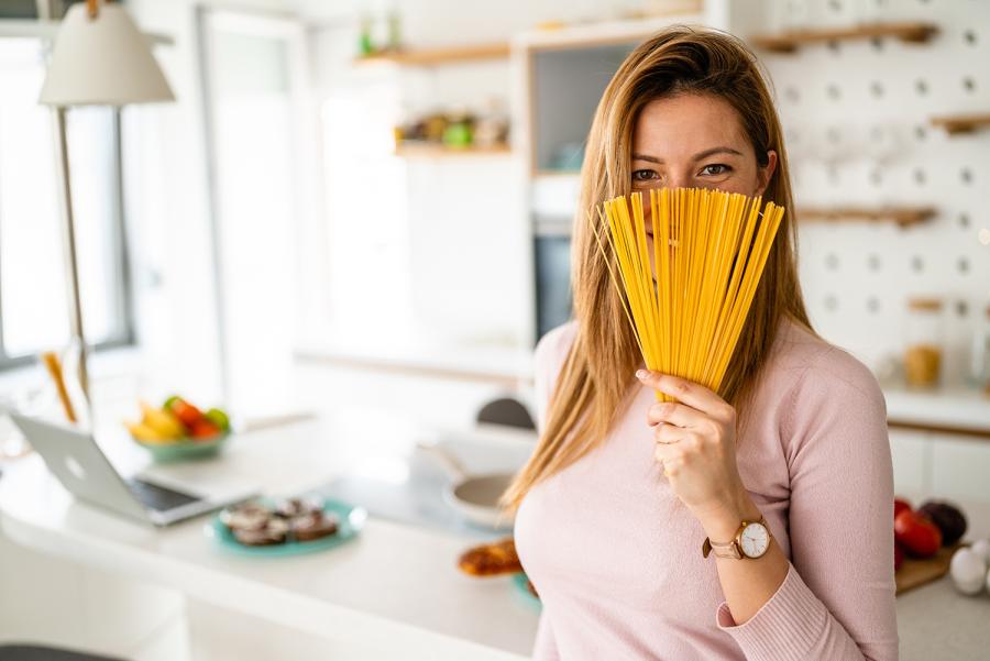 Woman holding dry pasta 