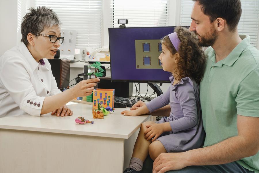 Family talking to speech therapist