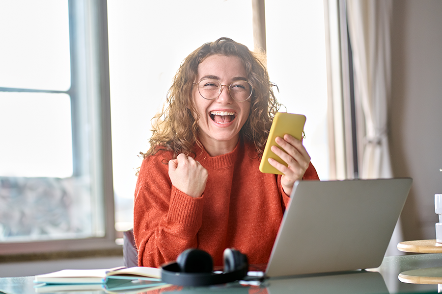 woman celebrating member rewards