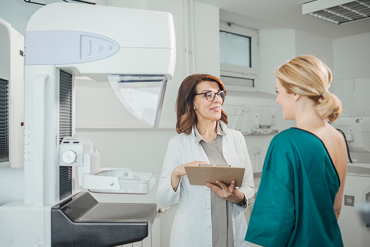 doctor with mammogram patient