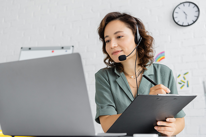 woman provides phone and computer support