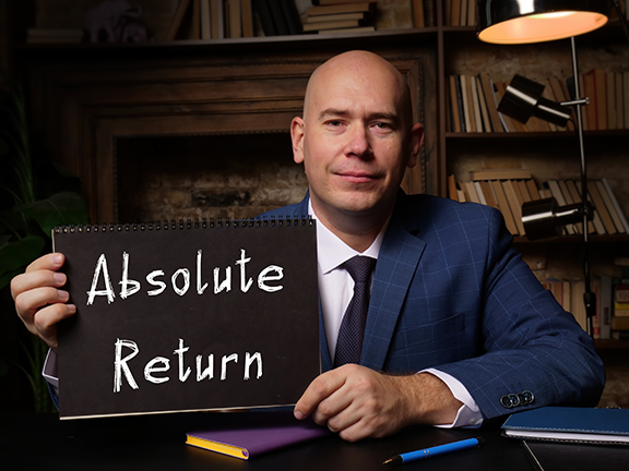 man holding sign that reads ‘absolute return’