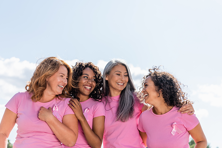 group of diverse women in pink shirts