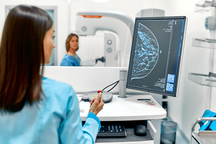 woman getting mammogram