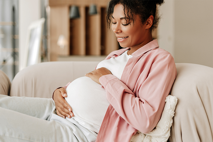 pregnant woman holding belly