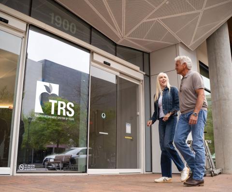 two retirees walk into TRS building
